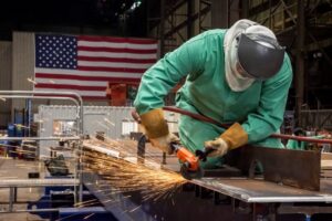 An Electric Boat employee working on a part of a Columbia Class submarine.